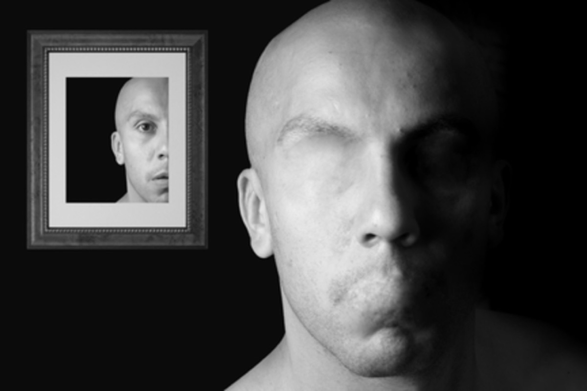 Diverse faces with cameras in creative workspace