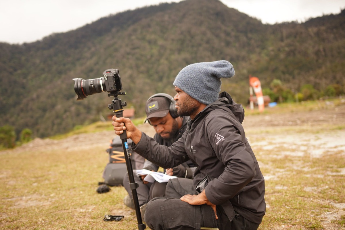 australian you-tuber filming outdoor scene