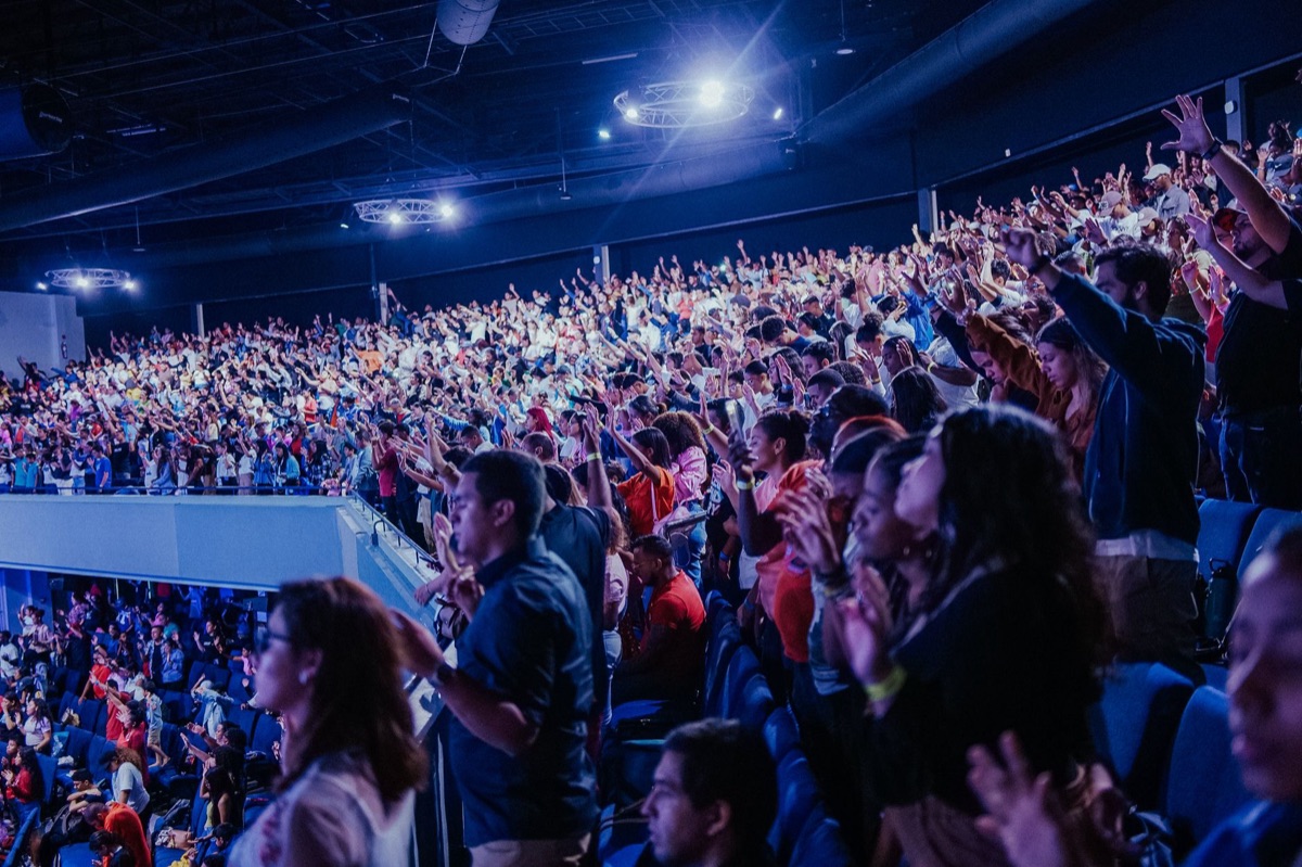 global audience members cheering in unison