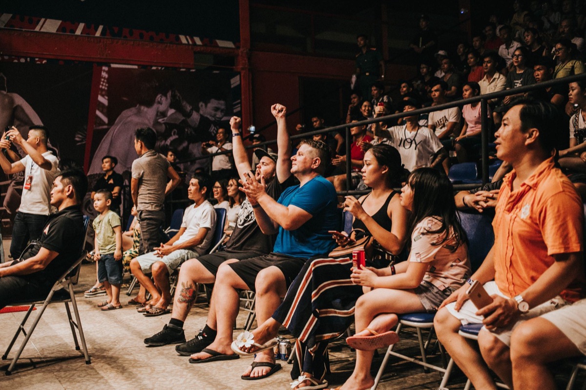 Global audience members cheering