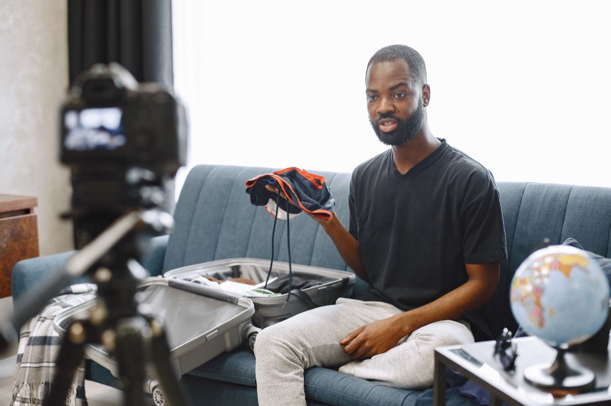 Australian YouTuber with camera and laptop equipment